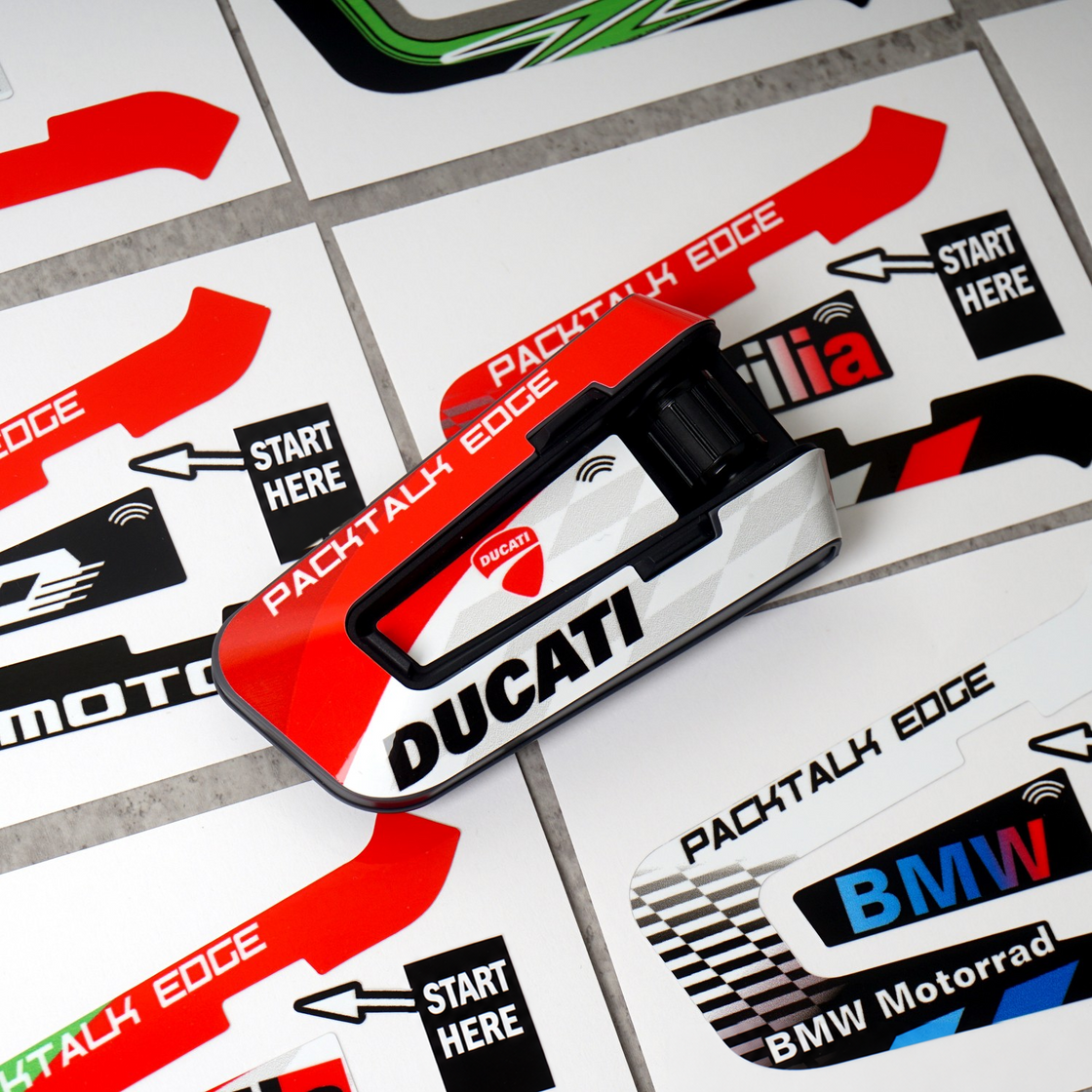 Racing-style PACKTALK EDGE decal sheets with English application starting-point labels.
